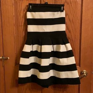 Strapless dress with zipper in back.